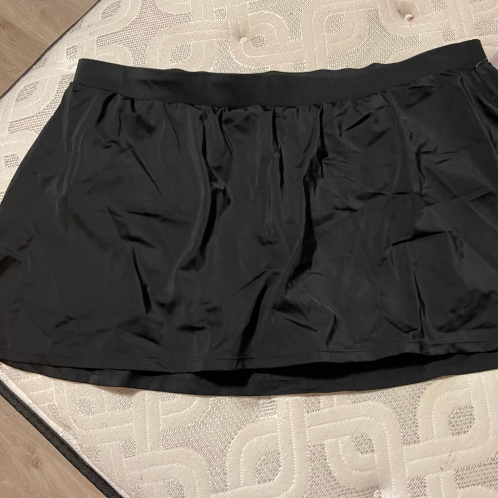 NWT Lane Bryant Cacique black swim skirt w side slit. Its very form flattering.